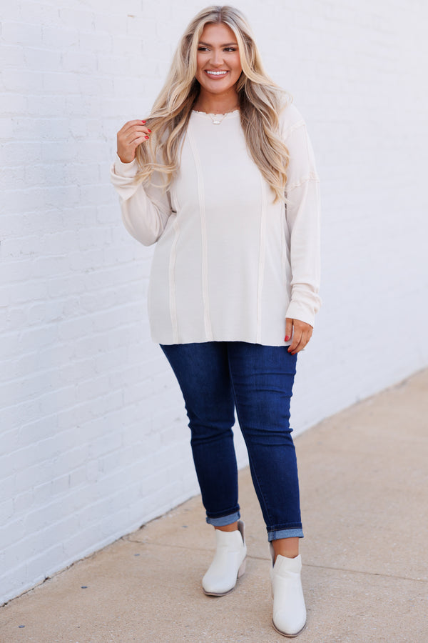 Chic Soul plus size clothing, cream colored long sleeve top with outward inseam detailing and raw hemilne on neckline