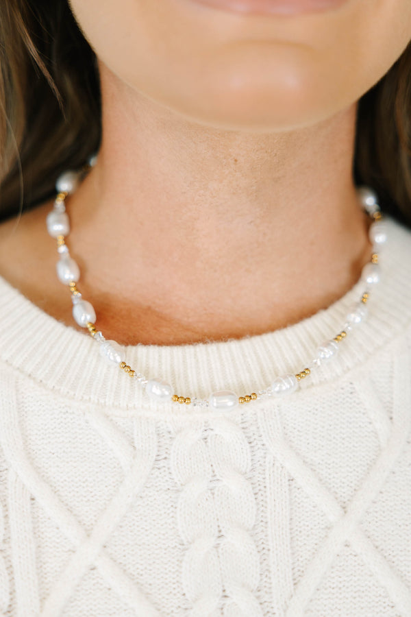 Morning Muse Necklace with white pearls and gold bead accents.