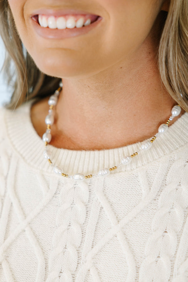 Morning Muse Necklace with white pearls and gold bead accents.