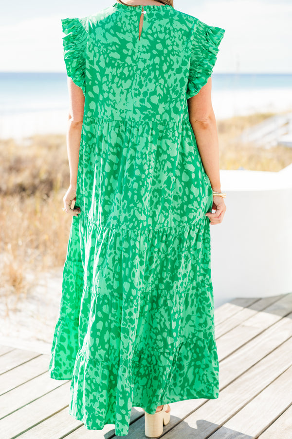 Chic Soul plus size clothing, short-flutter-sleeve green ruffled tiered maxi dress with a ruffled mockneck and a darker green abstract pattern with a keyhole closure on the back 