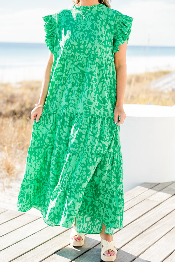 Chic Soul plus size clothing, short-flutter-sleeve green ruffled tiered maxi dress with a ruffled mockneck and a darker green abstract pattern with a keyhole closure on the back 