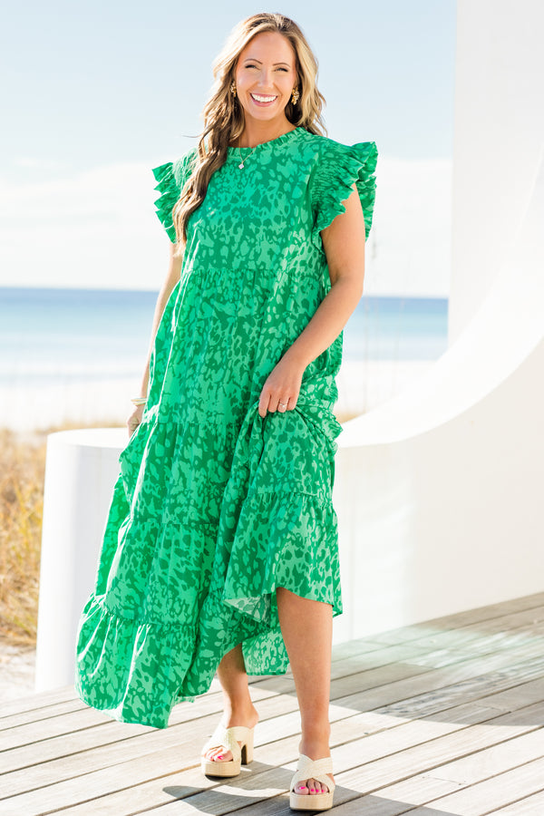 Chic Soul plus size clothing, short-flutter-sleeve green ruffled tiered maxi dress with a ruffled mockneck and a darker green abstract pattern with a keyhole closure on the back 