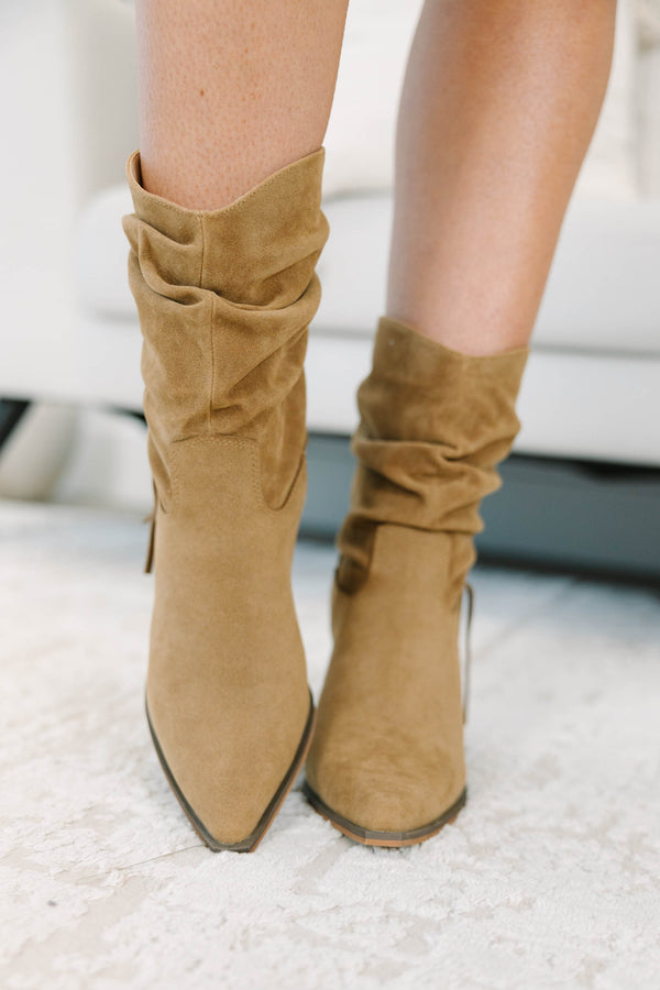 Tan suede-like booties with a slouchy shaft, fringe detail, and stacked block heel.