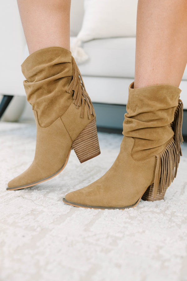 Tan suede-like booties with a slouchy shaft, fringe detail, and stacked block heel.