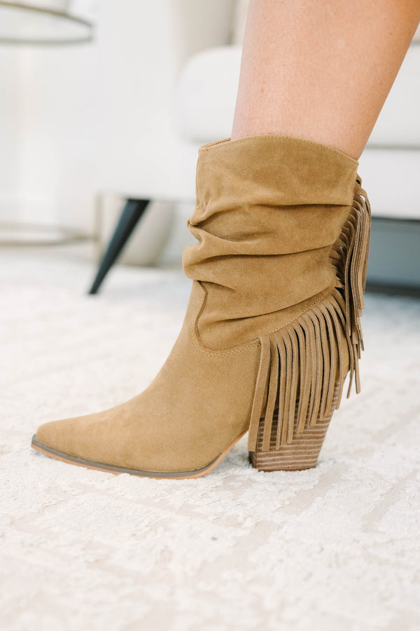 Tan suede-like booties with a slouchy shaft, fringe detail, and stacked block heel.