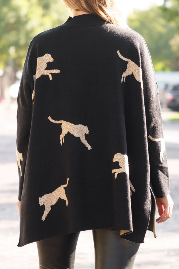 Chic Soul plus size clothing, black oversized sweater with animal prints and slits on the sides