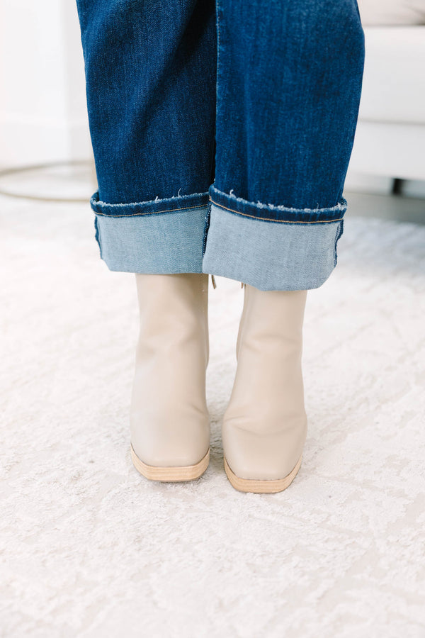 light cream Booties with a wooden block heel and platform.