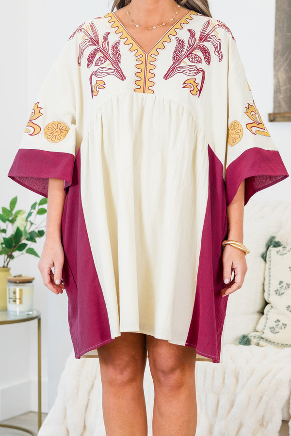 Chic Soul plus size clothing, white elbow length sleeve dress with fuchsia border detail along sides and sleeves with embroidered yellow and fuchsia print along v neckline and chest and sleeves with pockets