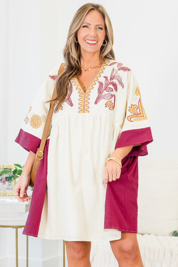 Chic Soul plus size clothing, white elbow length sleeve dress with fuchsia border detail along sides and sleeves with embroidered yellow and fuchsia print along v neckline and chest and sleeves with pockets