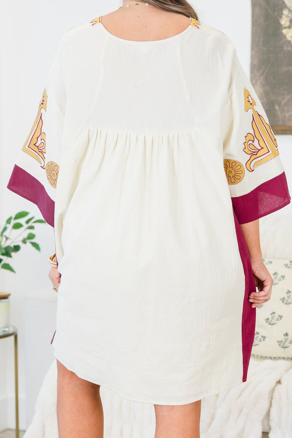 Chic Soul plus size clothing, white elbow length sleeve dress with fuchsia border detail along sides and sleeves with embroidered yellow and fuchsia print along v neckline and chest and sleeves with pockets