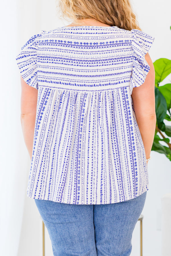 Chic Soul plus size clothing, blue and white abstract short sleeve top with v neckline and ruffle along sleeve with blue embroidery detail along chest
