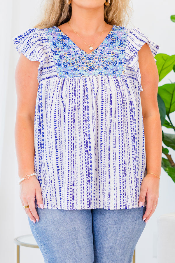 Chic Soul plus size clothing, blue and white abstract short sleeve top with v neckline and ruffle along sleeve with blue embroidery detail along chest
