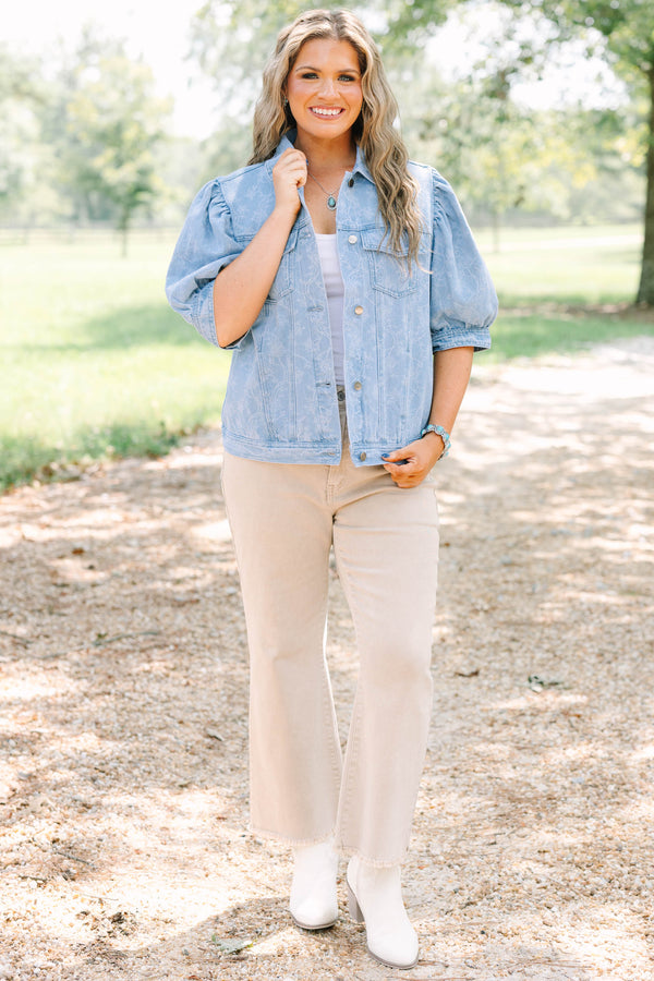 Plus Size light wash denim jacket with floral embroidery, puff sleeves, and silver buttons.