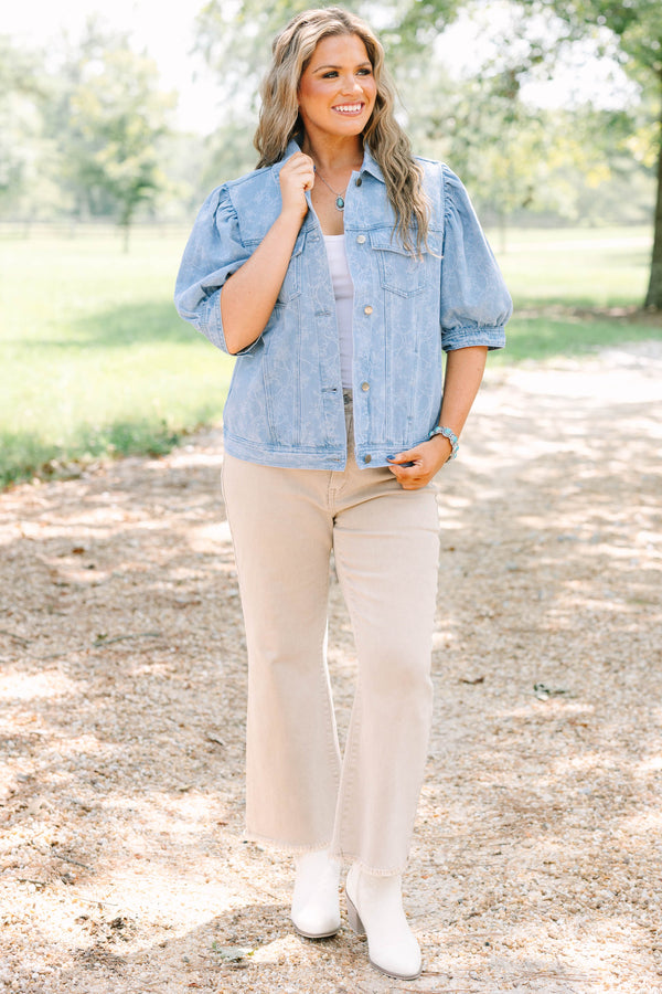 Plus Size light wash denim jacket with floral embroidery, puff sleeves, and silver buttons.