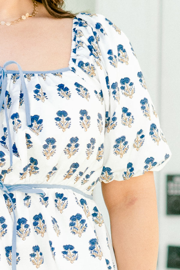 Chic Soul plus size clothing, white short sleeve top with a blue floral pattern and bubble sleeves 