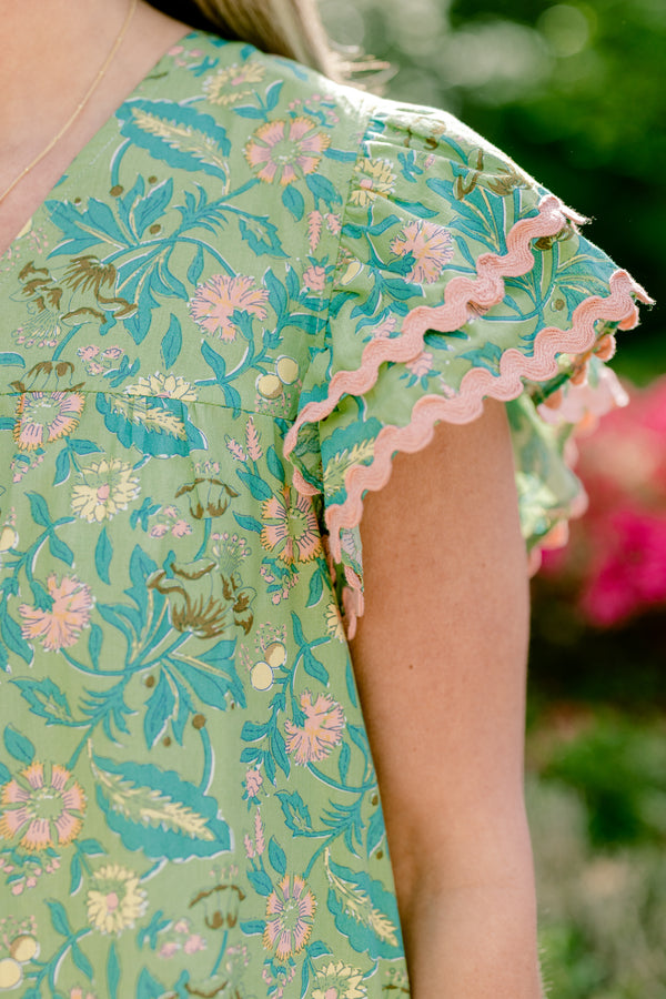 Chic Soul plus size clothing, floral green blouse with pink ric rac detailing and flutter sleeves