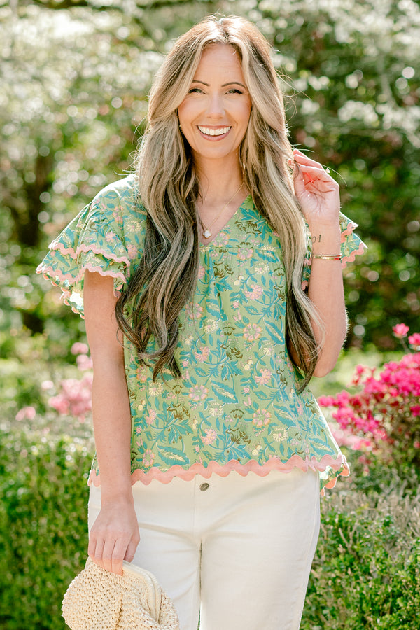 Chic Soul plus size clothing, floral green blouse with pink ric rac detailing and flutter sleeves