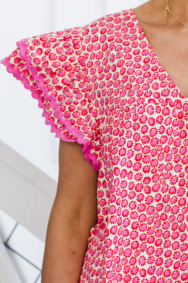 Chic soul plus size clothing, pink v-neck top with a floral pattern and flutter sleeves 