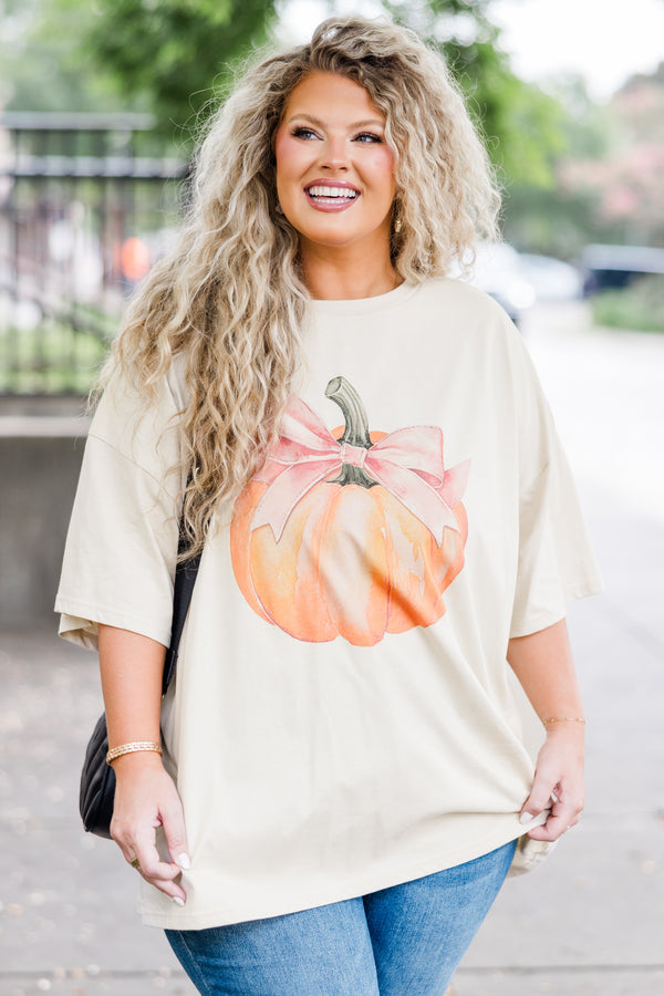 Chic Soul plus size clothing, beige short sleeve boyfriend tee with orange pumpkin graphic with a pink bow on the stem