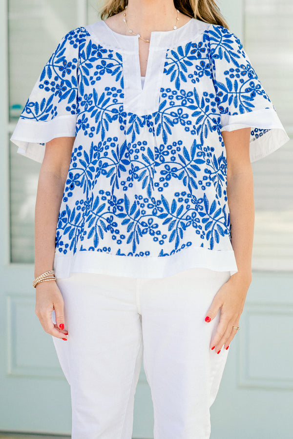 Chic Soul Plus size clothing, off white top with a blue floral pattern and a slight v-neck 
