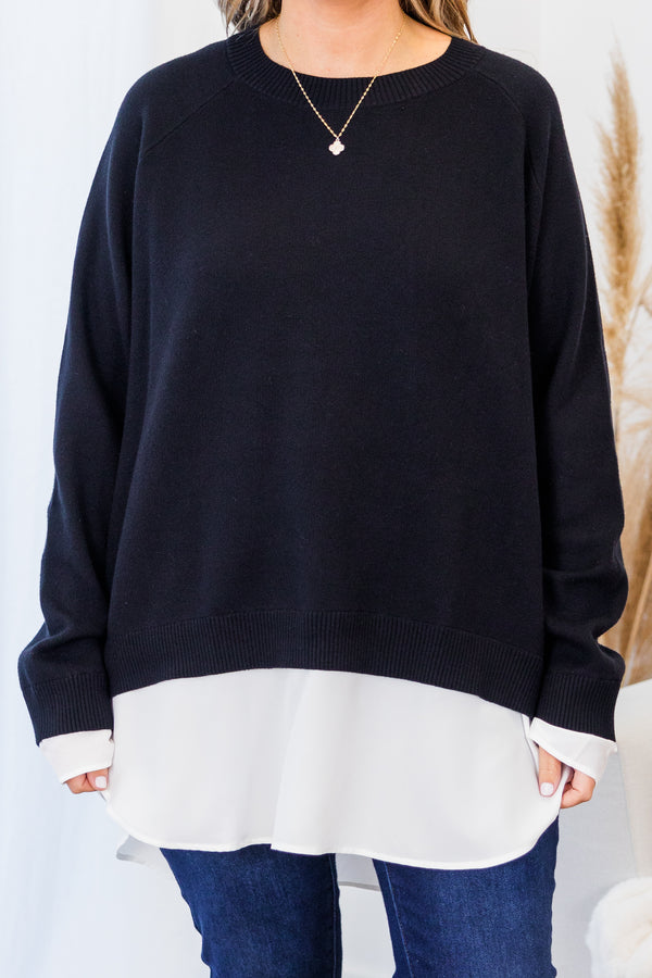 Chic Soul plus size clothing, black long sleeve knit sweater top with round neckline and cuff sleeves with white button up shirt underneath peeking out the bottom and sleeves