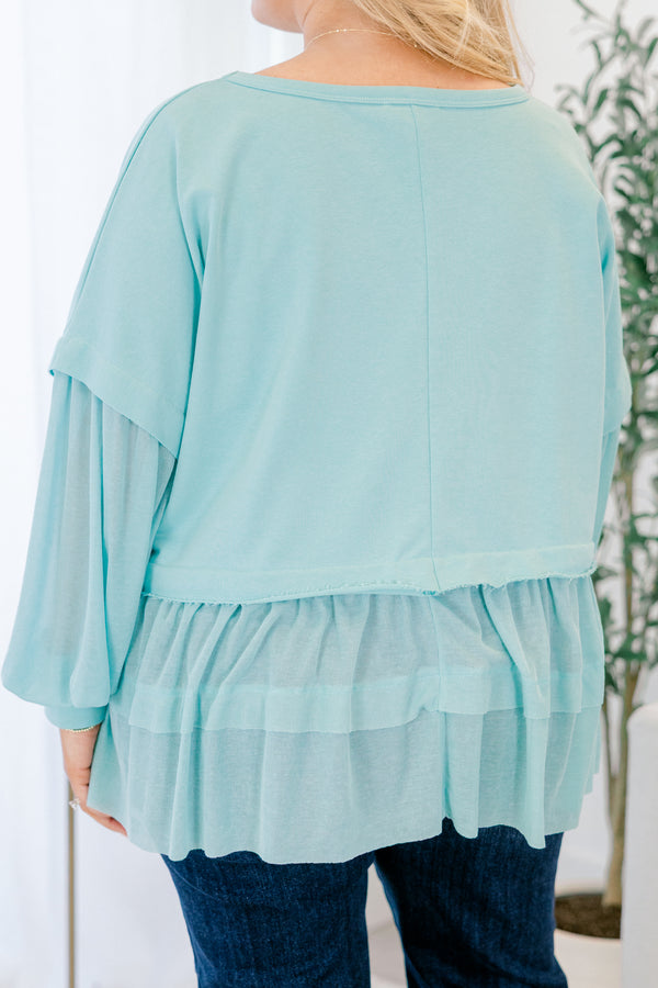 Chic Soul plus size clothing, seafoam blue long sleeve top with round neckline and cuff sleeves with tiered ruffle detail along the bottom