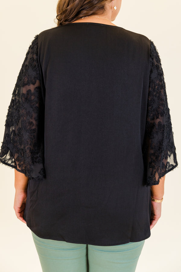 Chic Soul plus size clothing, short-sleeve black top with v-neckline and black lace sleeves with abstract stitching details