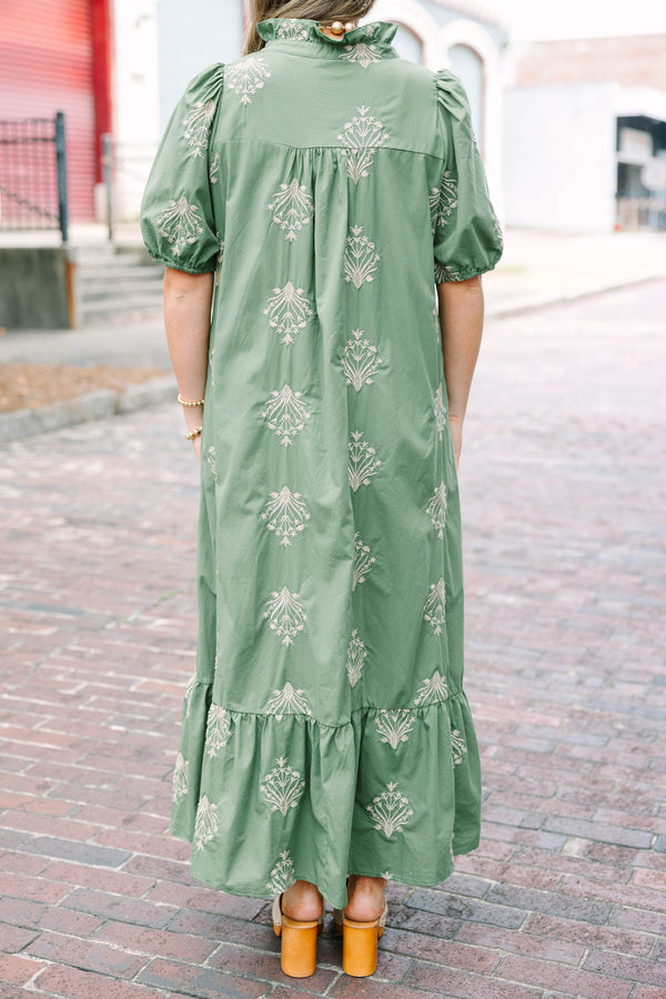 Plus Size olive green midi dress with cream botanical embroidery, puff sleeves, and a ruffled hem.
