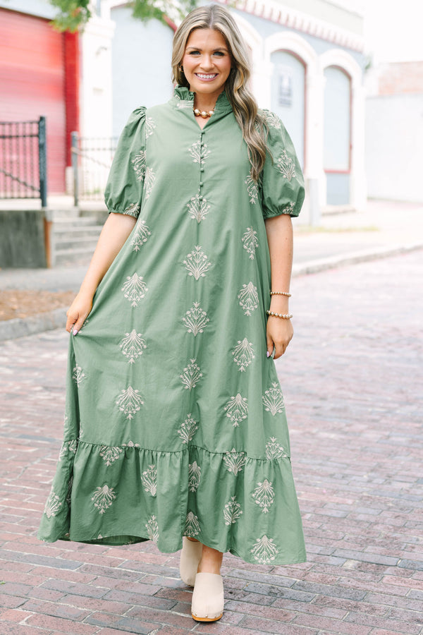 Plus Size olive green midi dress with cream botanical embroidery, puff sleeves, and a ruffled hem.