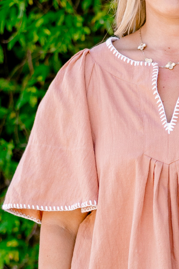 Chic Soul plus size clothing , brown top with bell sleeves that have white stitching details on the ends of the sleeves and along the v-neckline 