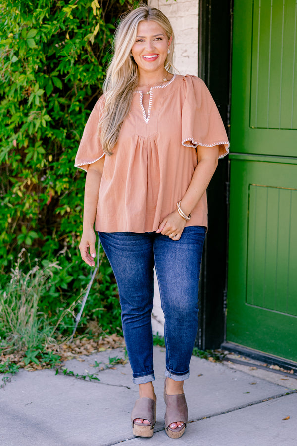 Chic Soul plus size clothing , brown top with bell sleeves that have white stitching details on the ends of the sleeves and along the v-neckline 