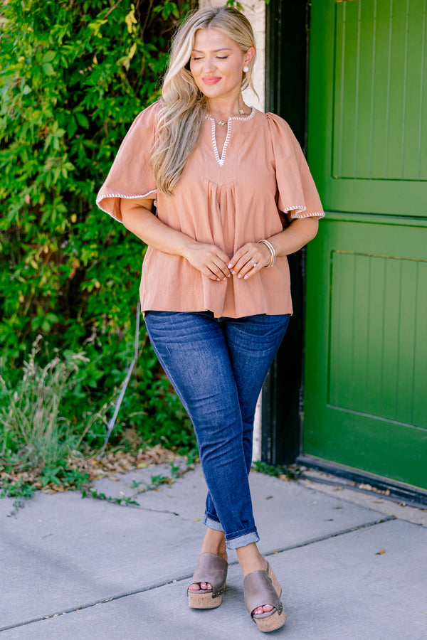 Chic Soul plus size clothing , brown top with bell sleeves that have white stitching details on the ends of the sleeves and along the v-neckline 
