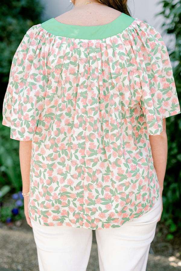 Chic Soul plus size clothing, flowy short sleeve blouse with green v-neck and peach and green floral print