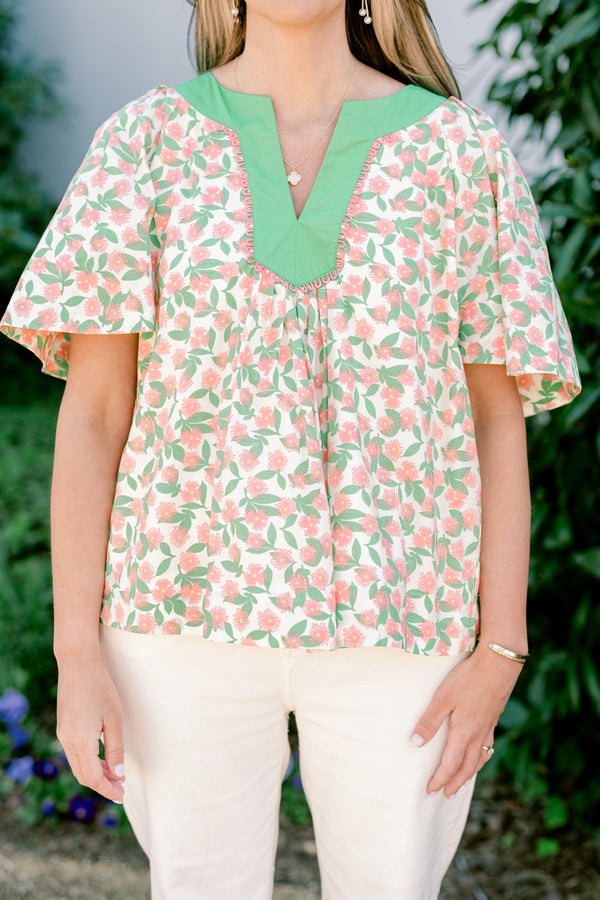 Chic Soul plus size clothing, flowy short sleeve blouse with green v-neck and peach and green floral print