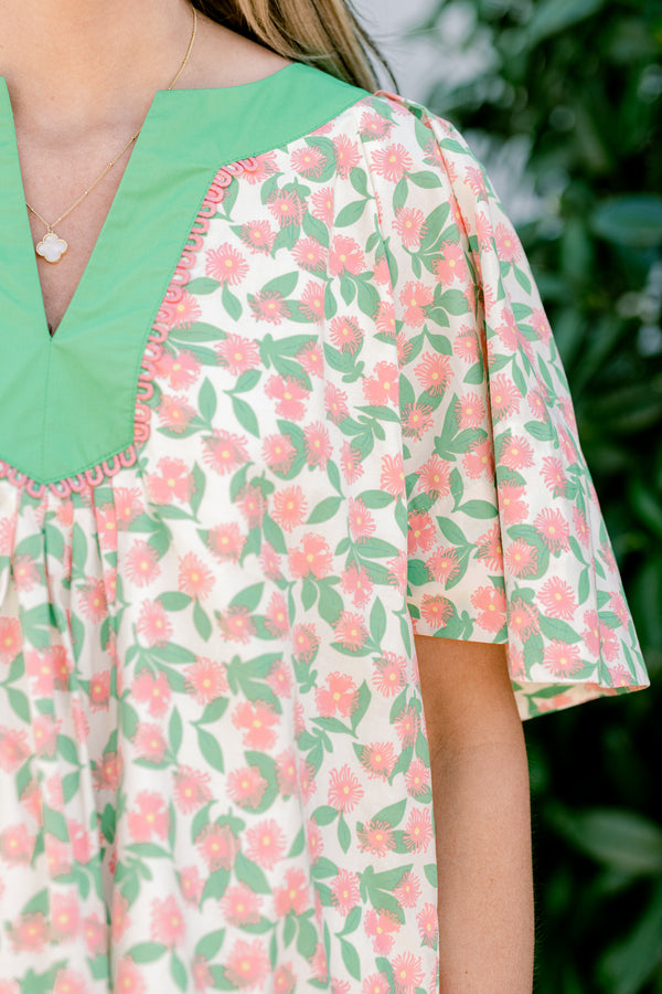 Chic Soul plus size clothing, flowy short sleeve blouse with green v-neck and peach and green floral print