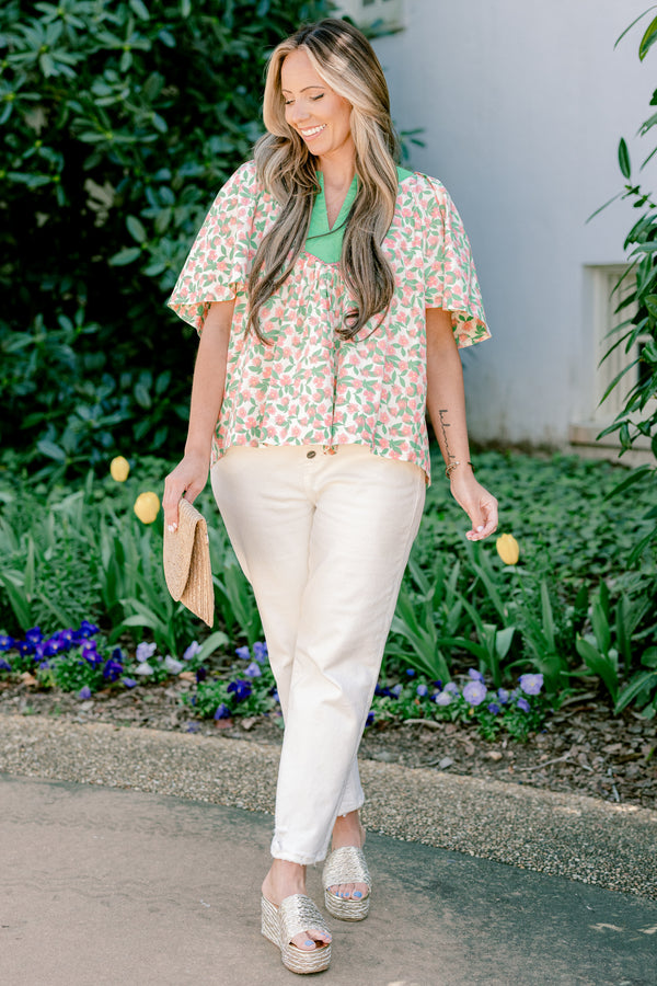 Chic Soul plus size clothing, flowy short sleeve blouse with green v-neck and peach and green floral print