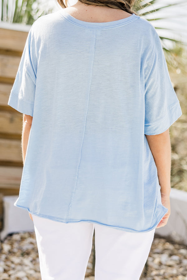 Plus Size light blue short sleeve cotton top with a front pocket and center seam detail.