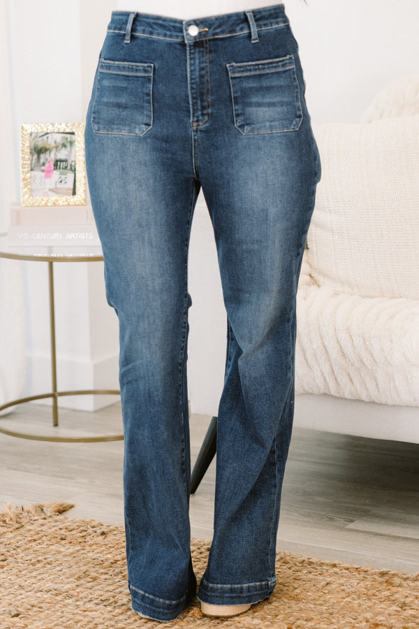 Plus Size high-rise flare jeans in a dark wash with front patch pockets.