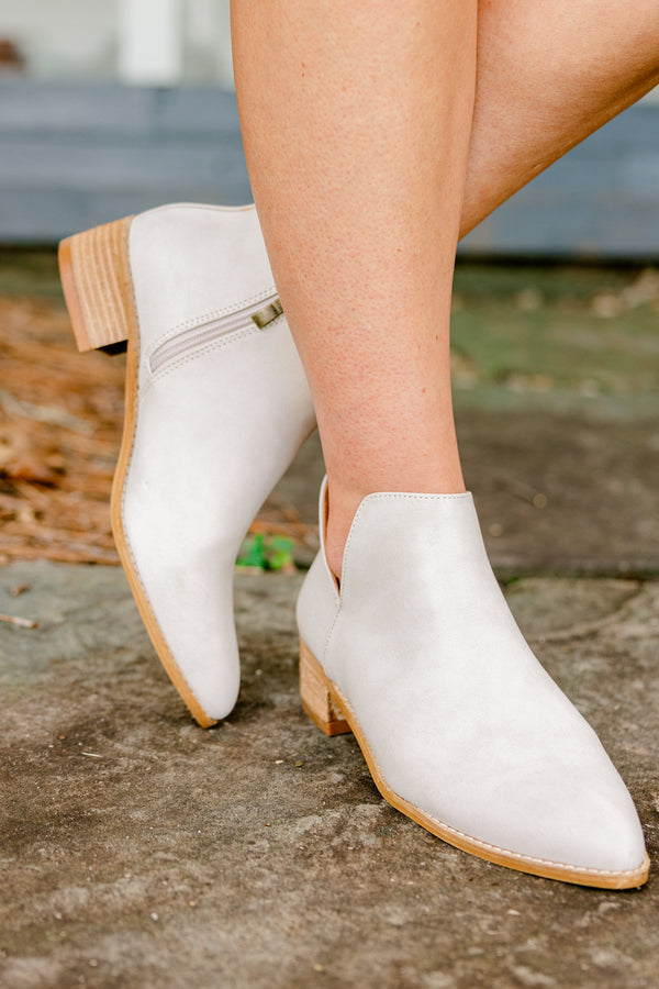 Chic Soul Plus size clothing, sand colored leather booties that come to a point at the end of the toes and have a zipper on the side 
