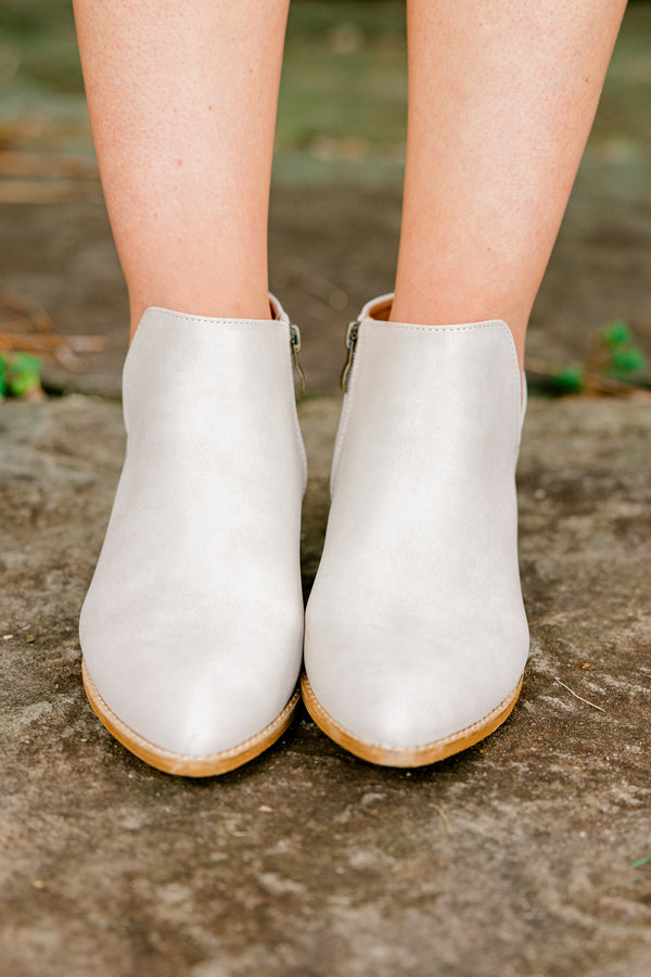 Chic Soul Plus size clothing, sand colored leather booties that come to a point at the end of the toes and have a zipper on the side 
