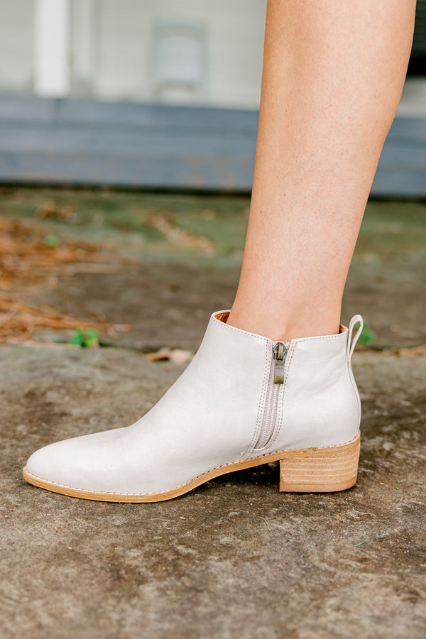 Chic Soul Plus size clothing, sand colored leather booties that come to a point at the end of the toes and have a zipper on the side 
