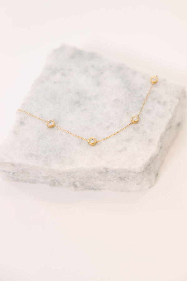 Plus Size gold-plated station necklace with bezel-set cubic zirconia stones on a refined chain.