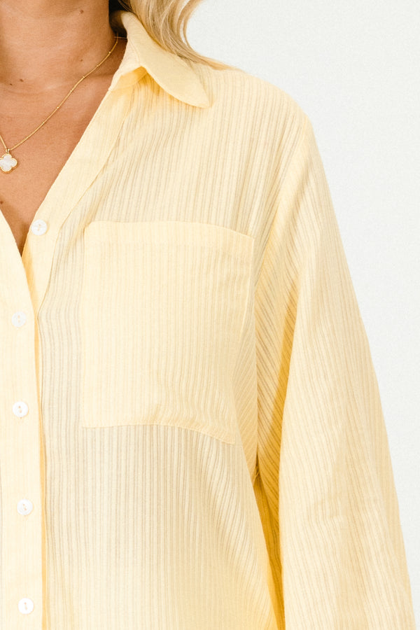 Chic Soul plus size clothing, light yellow long puff sleeve top with collar, button down front, and two breast pockets