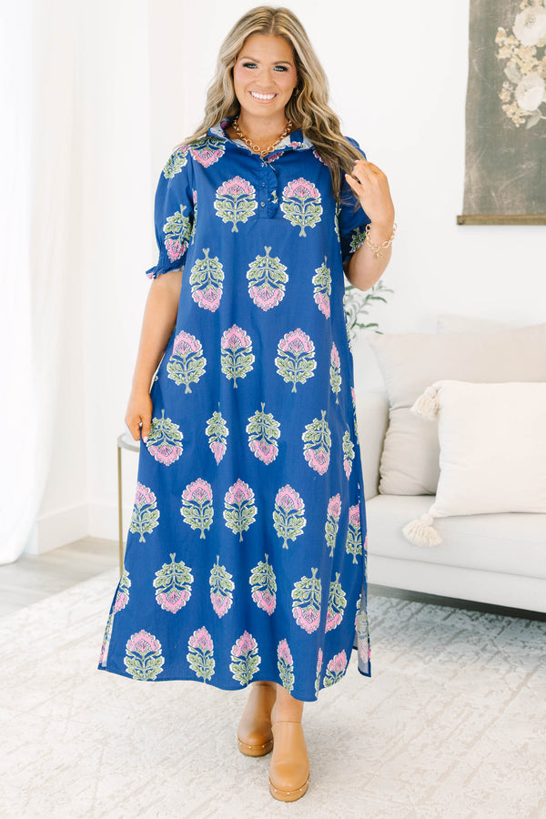 Plus Size navy floral maxi dress with short puff sleeves, a ruffled collar, and pink flower motifs.