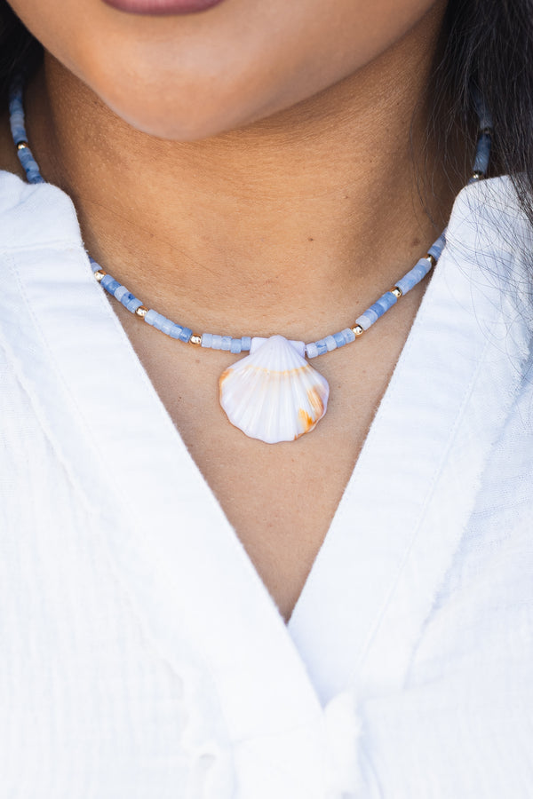 Chic Soul plus size clothing, blue beaded necklace with a seashell charm hanging off the center of the beads 