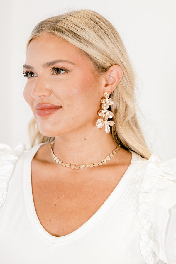 Chic Soul plus size clothing, three gold flowers that increase in size moving downward with pearl centers dangle earrings