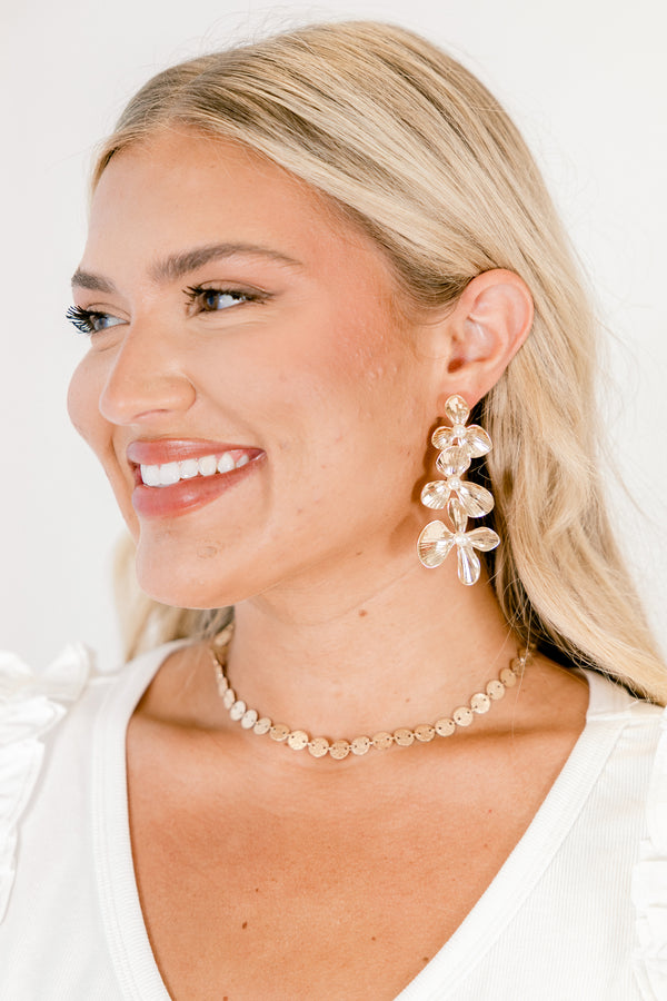 Chic Soul plus size clothing, three gold flowers that increase in size moving downward with pearl centers dangle earrings