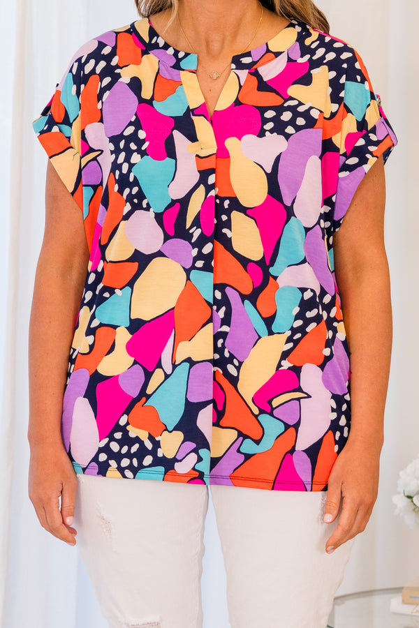 Chic Soul plus size clothing, short sleeve navy top with bright multi-colored geometric pattern and small v-neckline