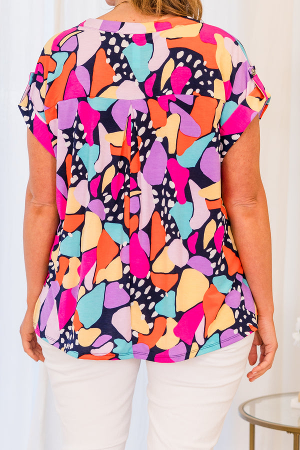 Chic Soul plus size clothing, short sleeve navy top with bright multi-colored geometric pattern and small v-neckline