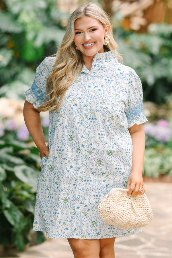 Chic Soul plus size clothing, blue knee length dress with bubble sleeves that have blue stitching details on the ends of sleeves and a floral block pattern throughout 